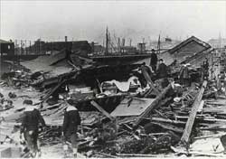 Sailors search through rubble in Boston's North End following the Great Molasses Flood in 1919, in an image from the book "Dark Tide" by Stephen Puleo. (photo from <a href="http://www.boston.com/news/local/articles/2009/03/19/lost_in_a_deadly_flood_and_stirred_by_every_page/" target="_blank">Boston.com article</a>)