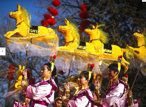 Performers do the horse dance on the evening of the Lunar New Year, or Spring Festival, at a park fair in Beijing (The Independent)